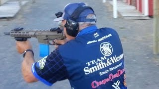 Champion shooter Jerry Miculek shooting full auto M4 rifle Crimson Trace Midnight 3gun [upl. by Asiilanna]