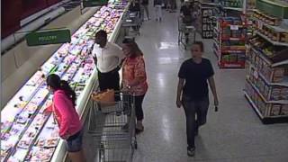 Woman steals Michael Kors purse from shopping cart [upl. by Yelda]