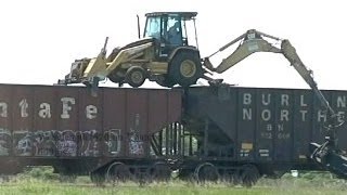 Backhoe on top of a train carI had no idea they did this [upl. by Epoh174]