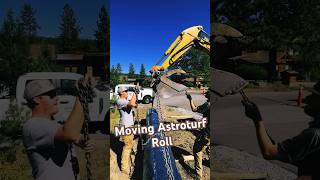 Moving 2000 lb Astroturf roll with miniex astroturf mini escavator chains jobsite landscape [upl. by Kohn]