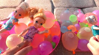 Water balloons Elsa amp Anna toddlers  pool  water fun  floaties [upl. by Ahtikal]