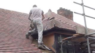 Reroofing my your house Cementing the small hip roof wwwgarecoukroof [upl. by Daus]