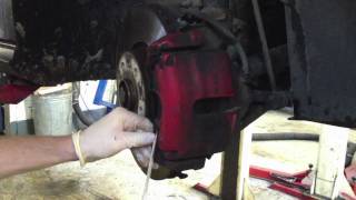 Replacing VW Golf Mk5 front brake pads and discs  quotHow toquot [upl. by Idalina]