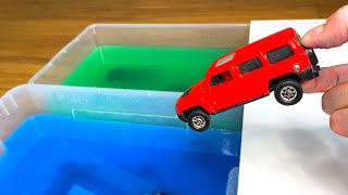 Various Red Diecast Model Cars Fallling Into The Green and Blue Water [upl. by Ellecram]