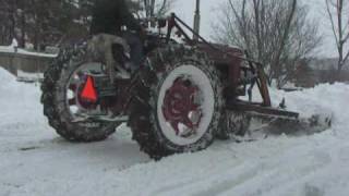 Blizzard of 2010  Plowing my driveway with the Farmall M [upl. by Eladnwahs405]