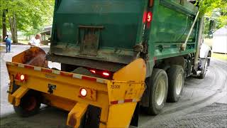 Spreading gravel with a skid loader epoke and mac truck [upl. by Elenore]