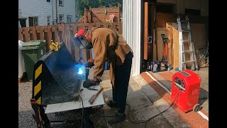 Adding 7014 Weld With My Buzz Box On My Front Bucket Cutting Bar On My Mahindra eMax 20S HST Tractor [upl. by Nivrek844]