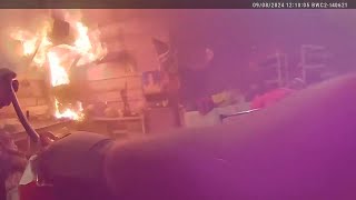 Body cam shows Roscommon Co deputy run into burning garage putting out fire [upl. by Pascasia]