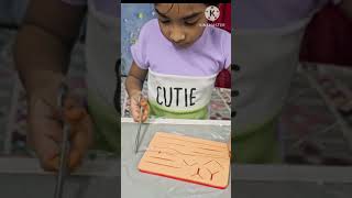 My 8yo practicing simple interrupted suture [upl. by Ylehsa]